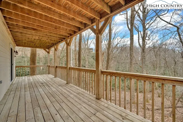 a view of balcony with wooden floor