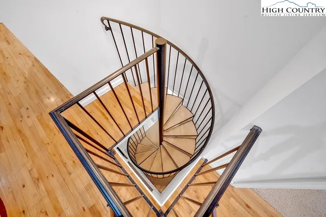 a view of staircase with black and white walls