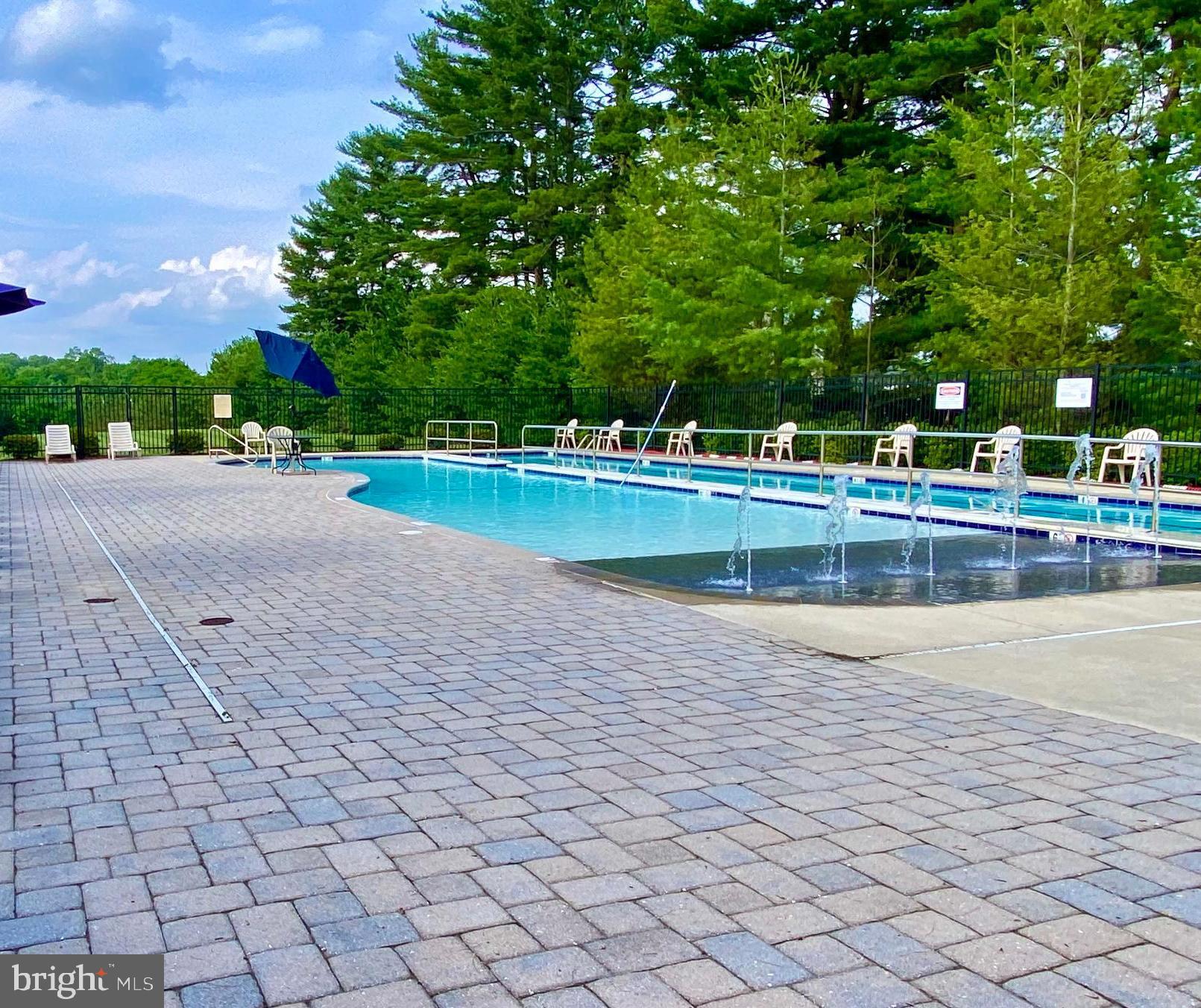 6467 Cornwall Drive, Unit 56 Eldersburg, MD 21784 - Photo 11 of 35 a view of a swimming pool and a yard