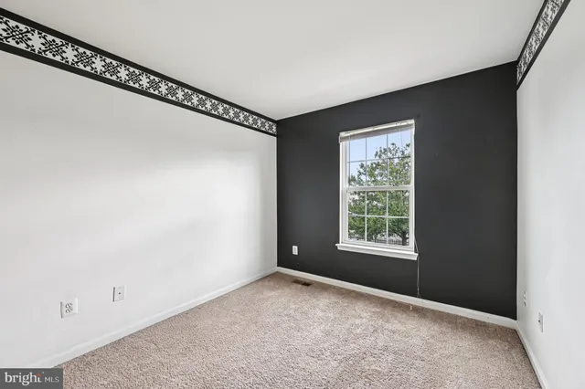 a bathroom with a sink a toilet a mirror a bathtub and shower