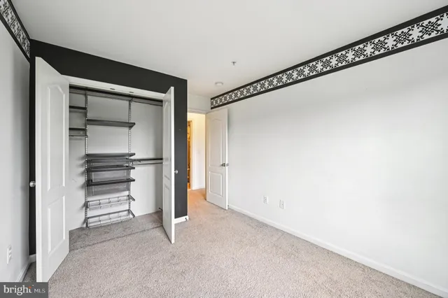 a view of room with window and ceiling fan