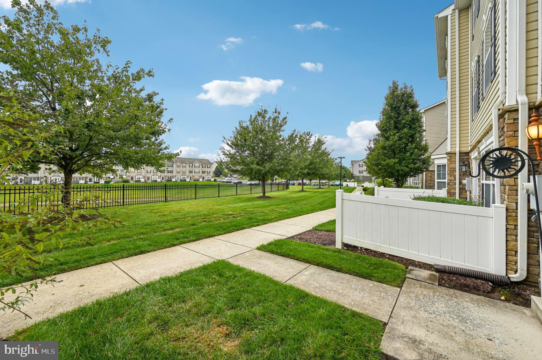 6467 Cornwall Drive, Unit 56 Eldersburg, MD 21784 - Photo 25 of 35 a view of a house with a yard and sitting area