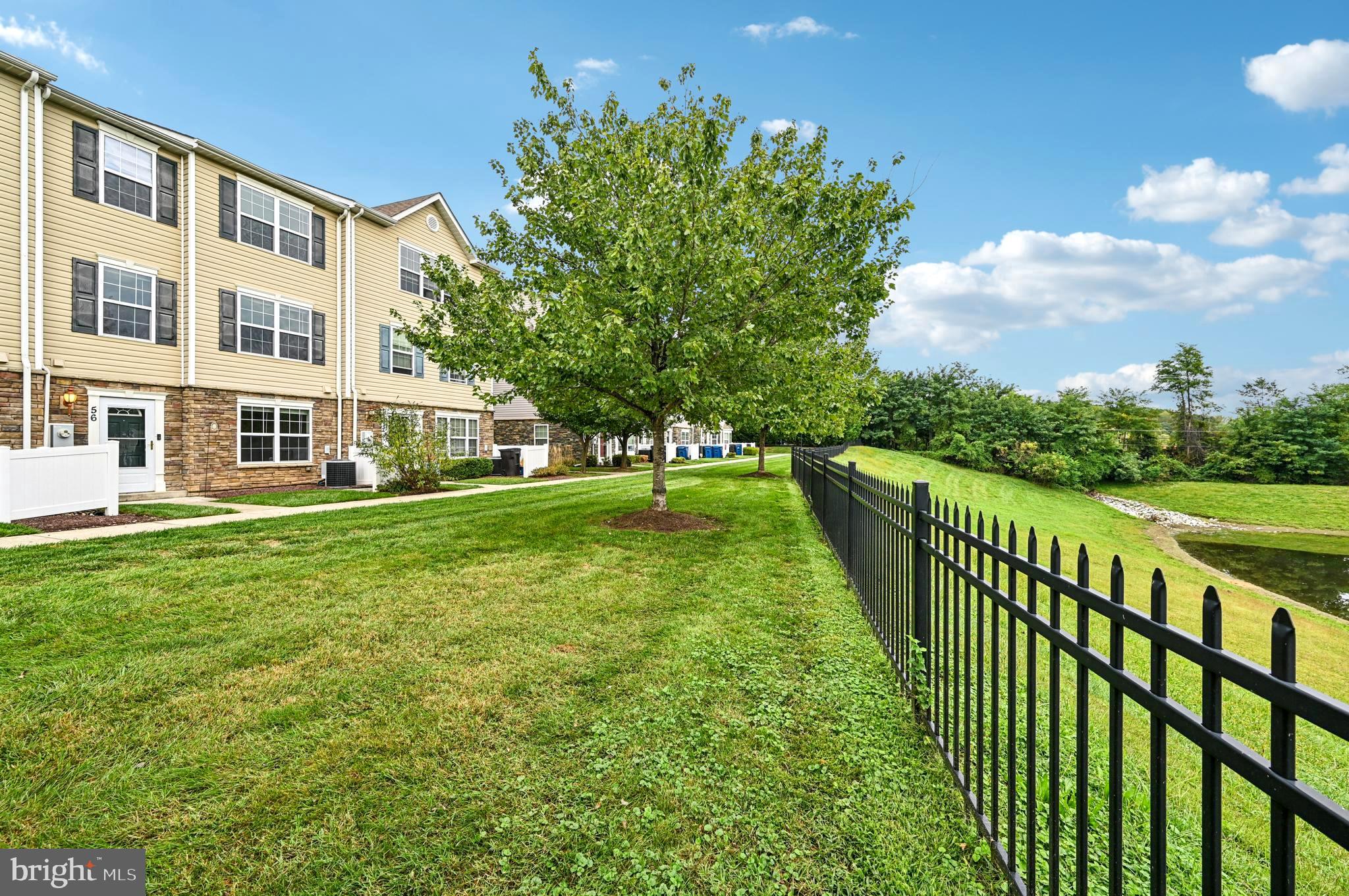 6467 Cornwall Drive, Unit 56 Eldersburg, MD 21784 - Photo 26 of 35 a view of a house with a yard