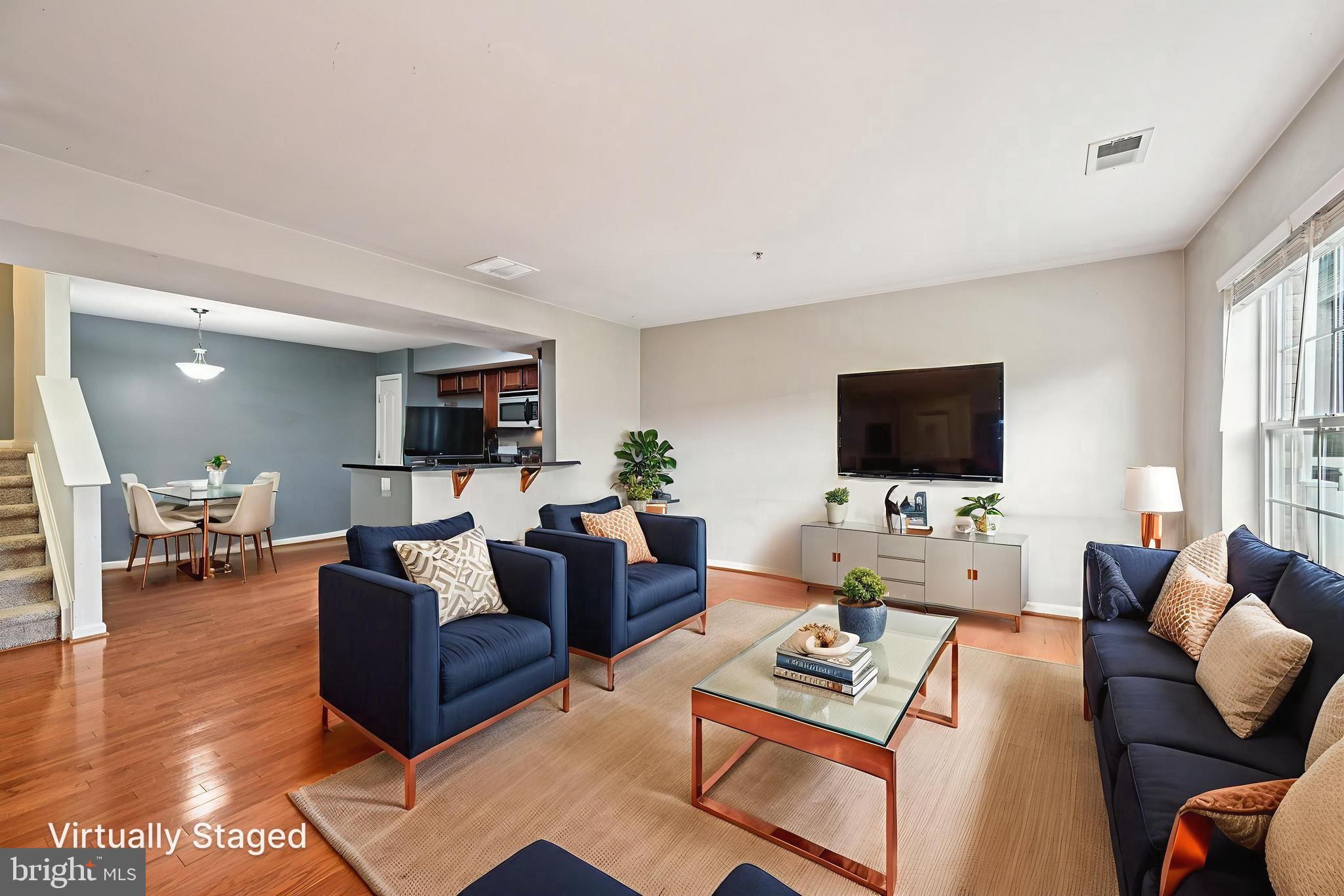 6467 Cornwall Drive, Unit 56 Eldersburg, MD 21784 - Photo 4 of 35 a living room with furniture and a flat screen tv