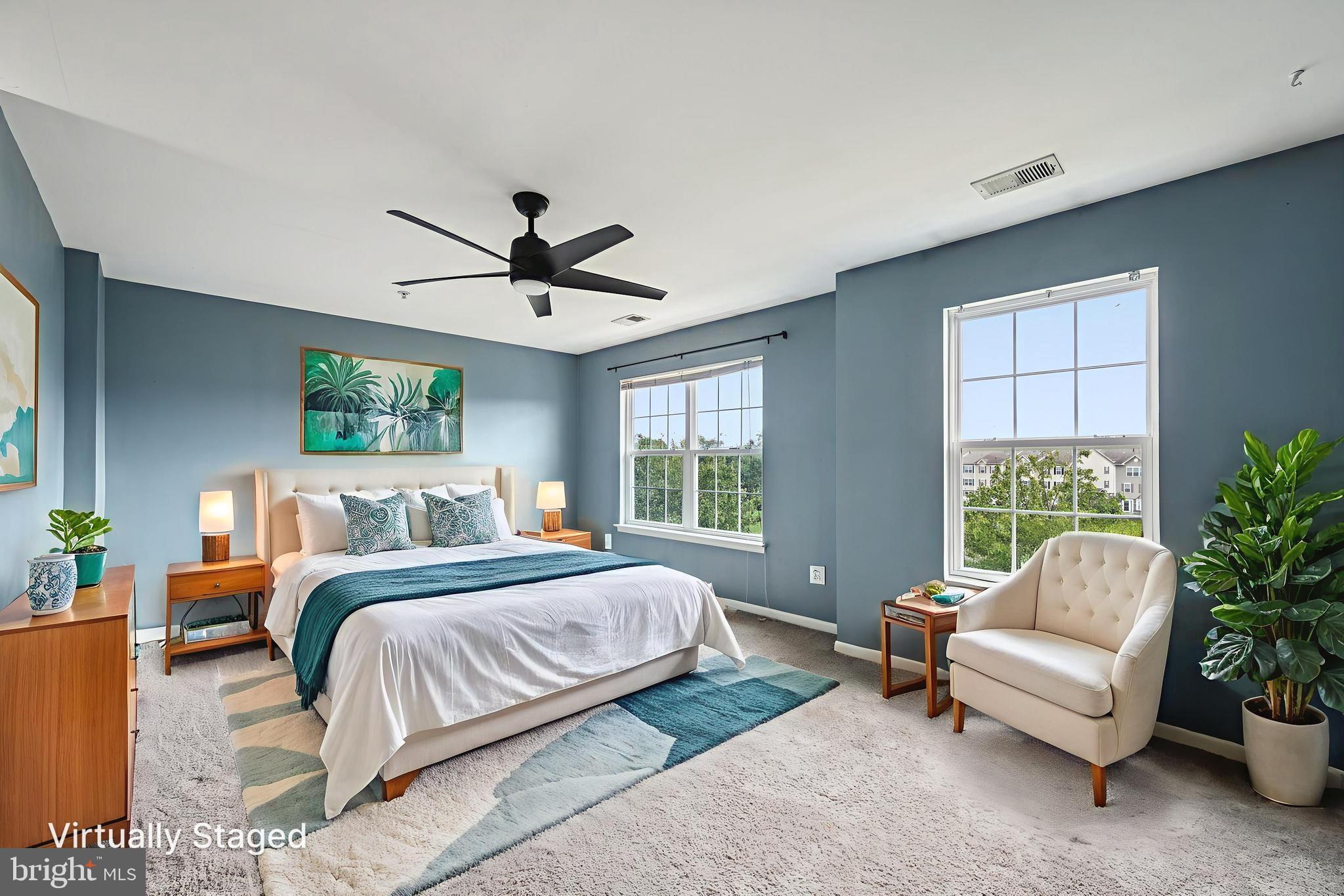 6467 Cornwall Drive, Unit 56 Eldersburg, MD 21784 - Photo 6 of 35 a bedroom with a bed and a couch