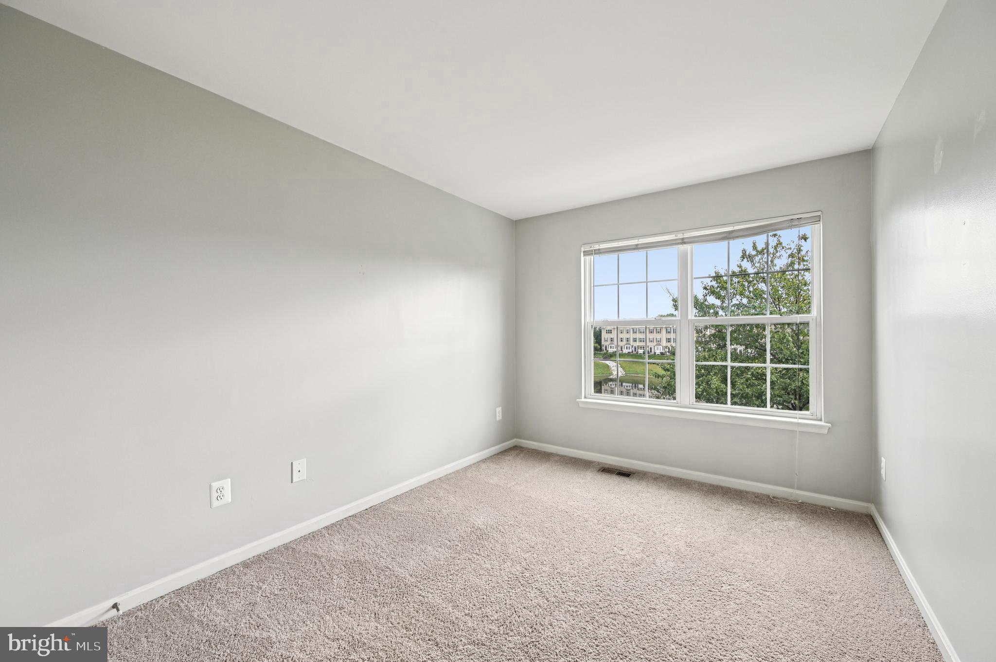 6467 Cornwall Drive, Unit 56 Eldersburg, MD 21784 - Photo 8 of 35 an empty room with windows