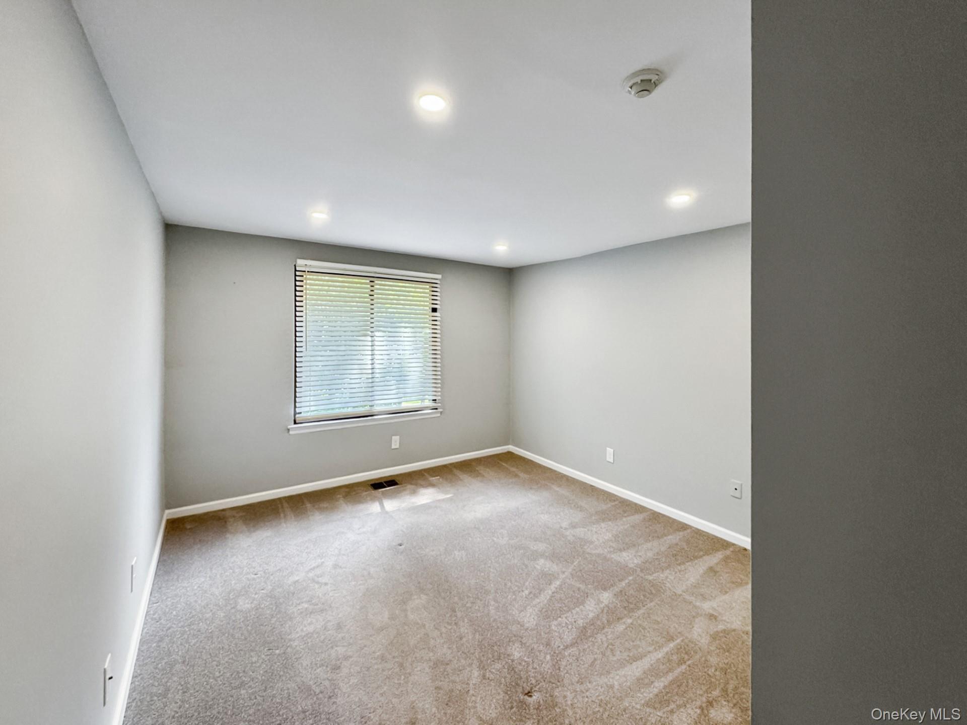 100 Glen Hollow Drive Port Jefferson Station, NY 11776 - Photo 13 of 21 an empty room with a window