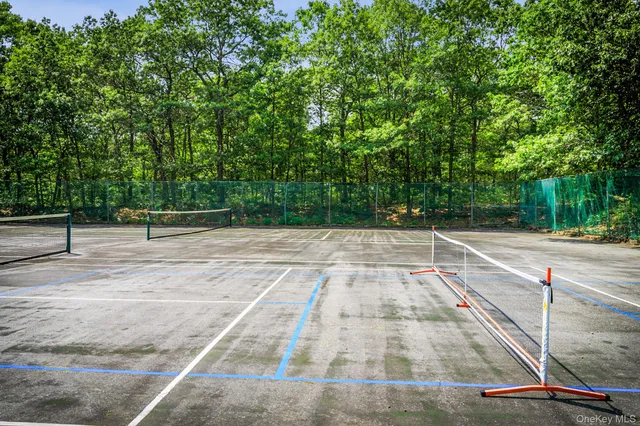 a swimming pool with wooden fence