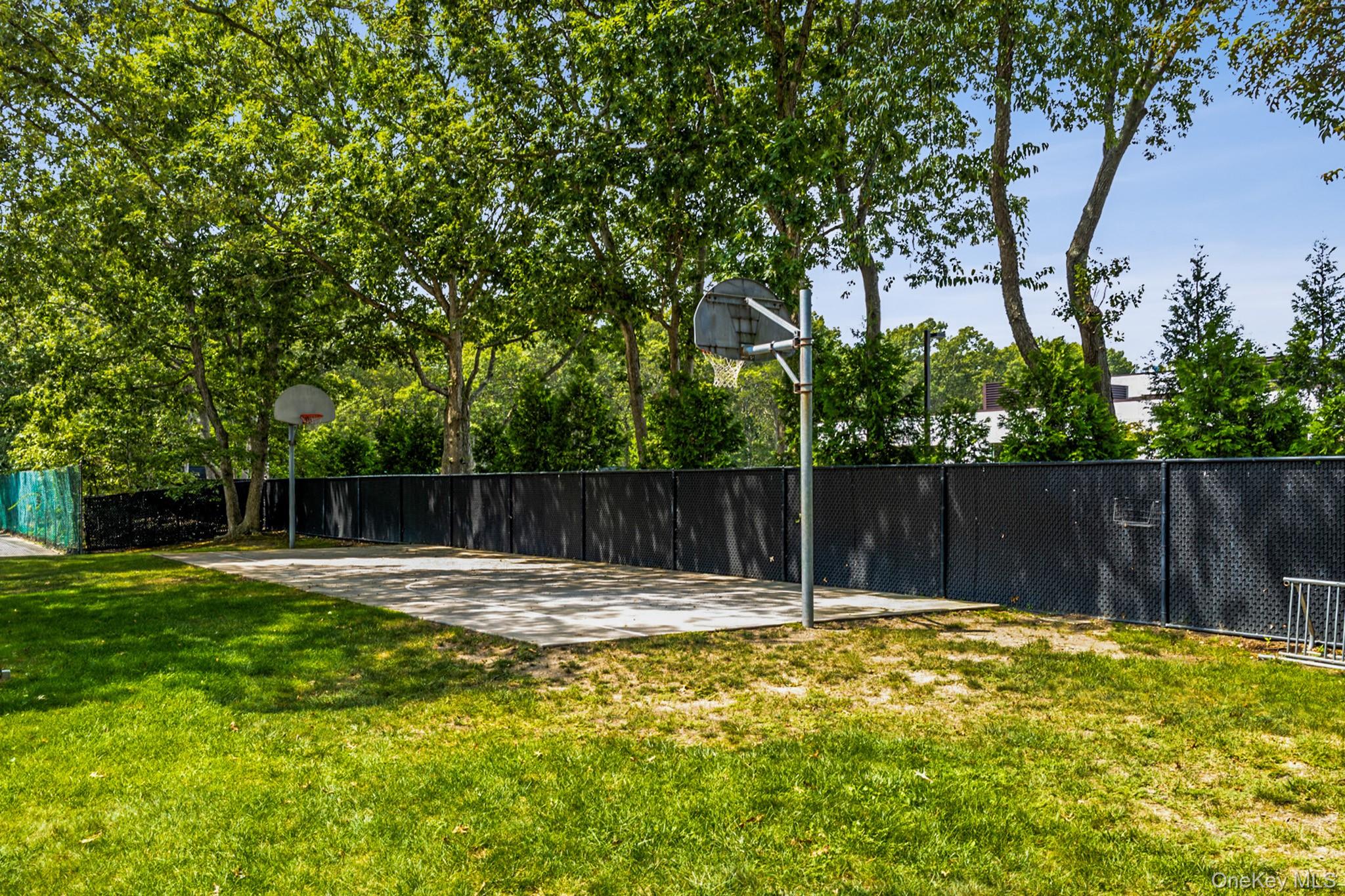 100 Glen Hollow Drive Port Jefferson Station, NY 11776 - Photo 20 of 21 a swimming pool with wooden fence