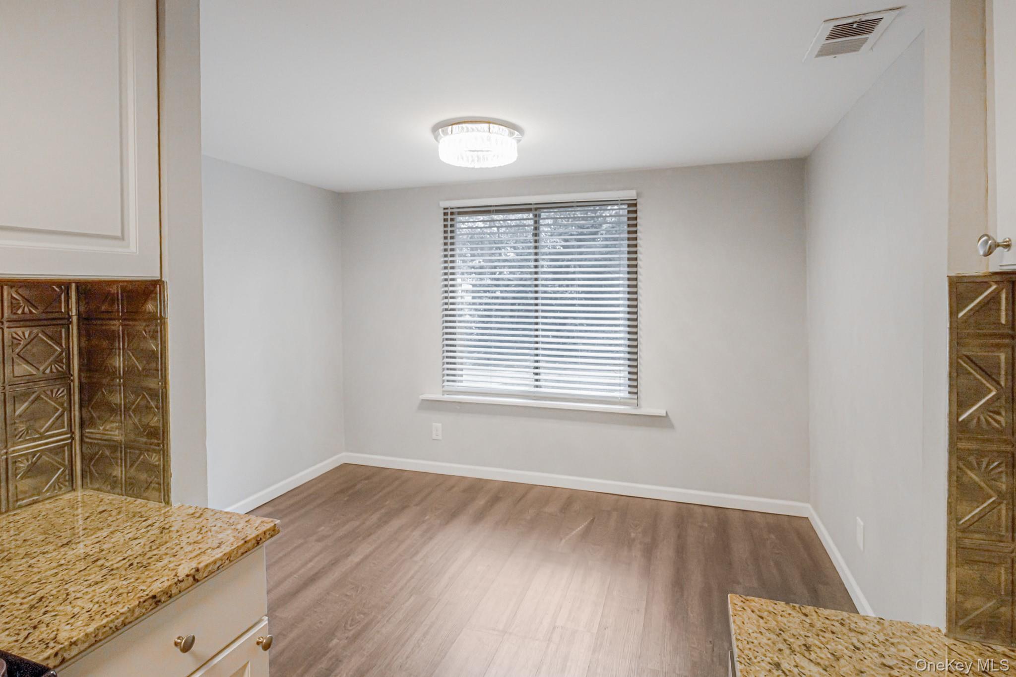 100 Glen Hollow Drive Port Jefferson Station, NY 11776 - Photo 4 of 21 a view of an empty room and window