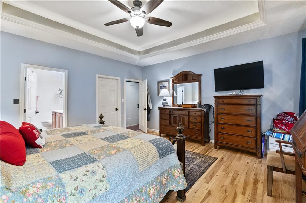 11580 Percheron Circle Irwin, PA 15642 - Photo 11 of 26 a bedroom with a bed and a flat screen tv