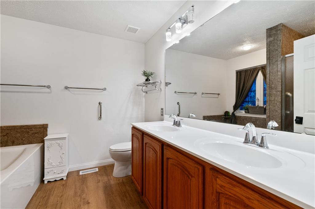 11580 Percheron Circle Irwin, PA 15642 - Photo 12 of 26 a bathroom with a sink double vanity granite and a toilet