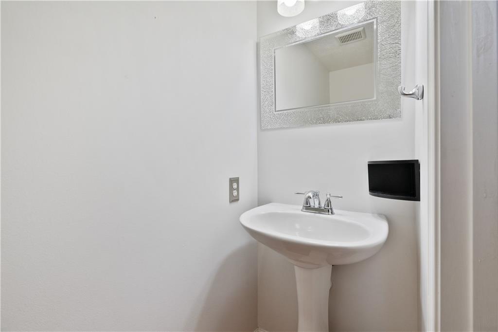11580 Percheron Circle Irwin, PA 15642 - Photo 13 of 26 a bathroom with a sink and a mirror