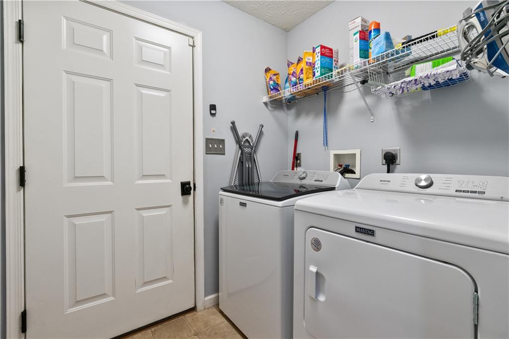 11580 Percheron Circle Irwin, PA 15642 - Photo 14 of 26 a utility room with dryer and washer
