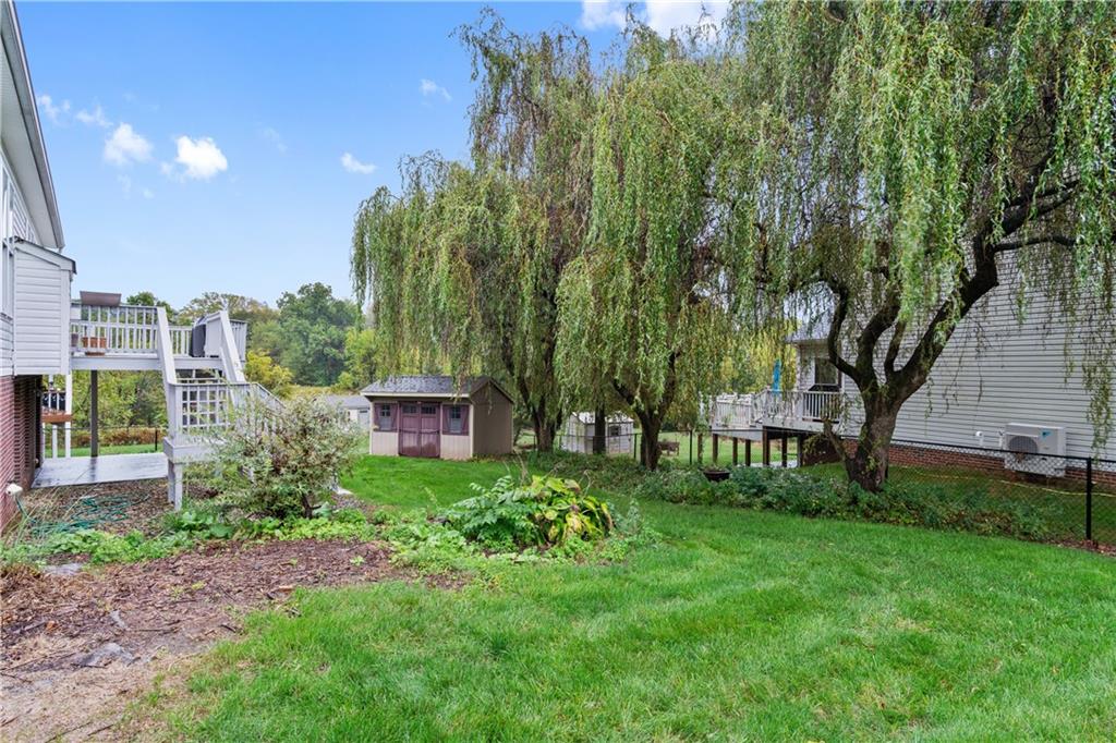 11580 Percheron Circle Irwin, PA 15642 - Photo 25 of 26 a view of a garden with a bench