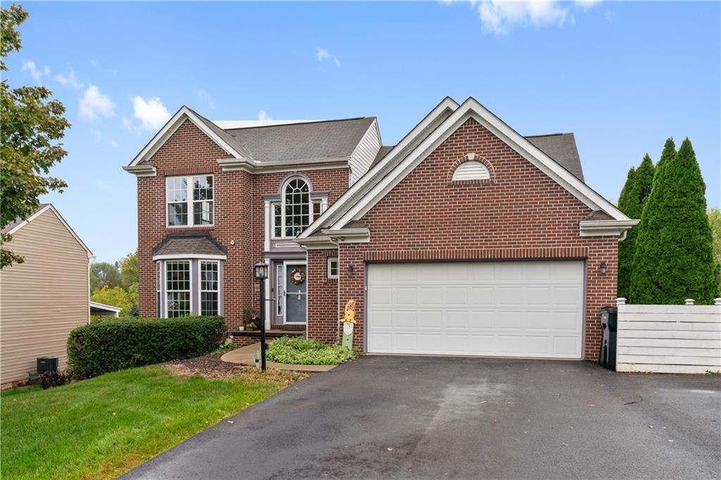 11580 Percheron Circle Irwin, PA 15642 - Photo 26 of 26 a front view of a house with a yard and garage