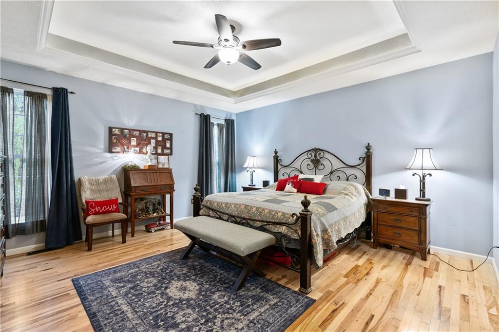 11580 Percheron Circle Irwin, PA 15642 - Photo 10 of 26 a bedroom with a bed a dresser and a chandelier