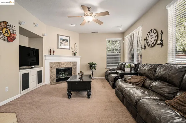 a view of a dining room with furniture and a chandelier