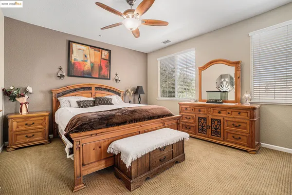 a spacious bathroom with a double vanity sink mirror and