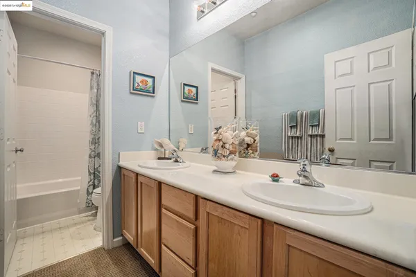 a view of a storage & utility room with a washer dryer