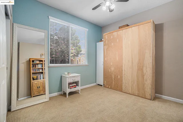 a view of a dinning table and chairs in patio of the house