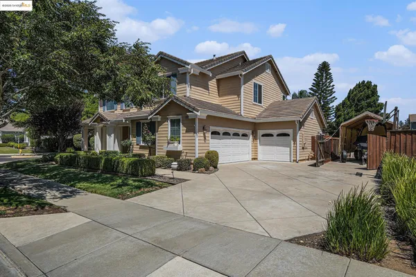 a living room with furniture and two large window