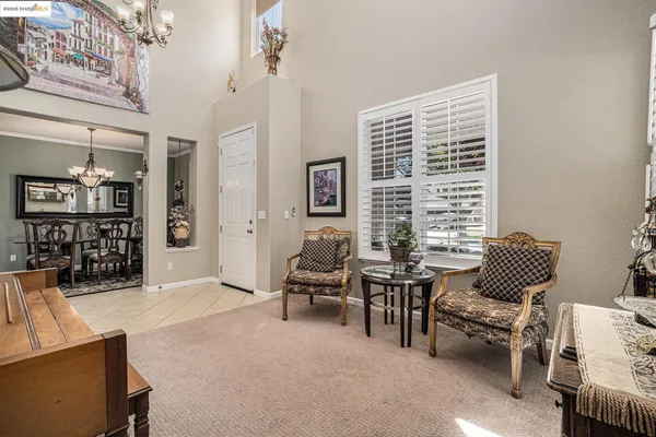 a view of a livingroom with furniture and stairs