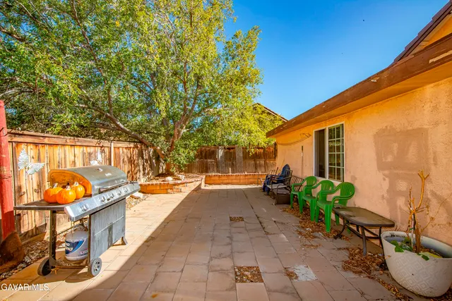 a backyard of a house with seating space