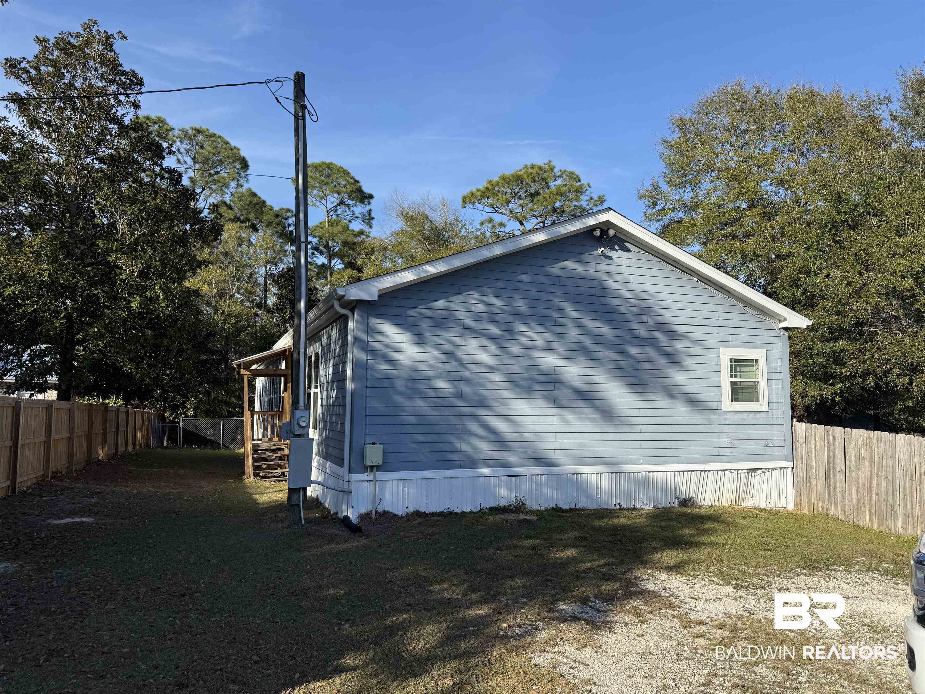 1274 Caney Loop Lillian, AL 36549 - Photo 2 of 19 View of side of home