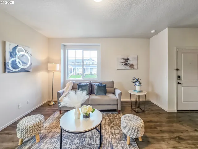a living room with furniture and a table
