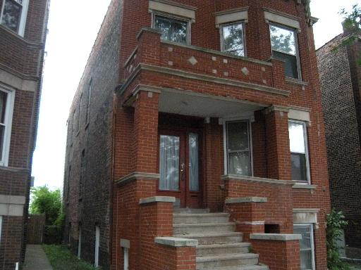 4338 West Cermak Road Chicago, IL 60623 - Photo 1 of 3 a front view of a house
