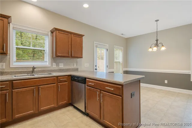 a kitchen with sink cabinets and window