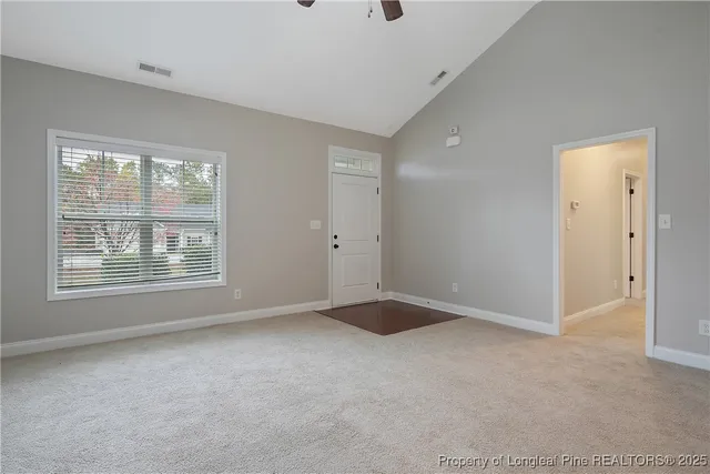 a view of an empty room with a window