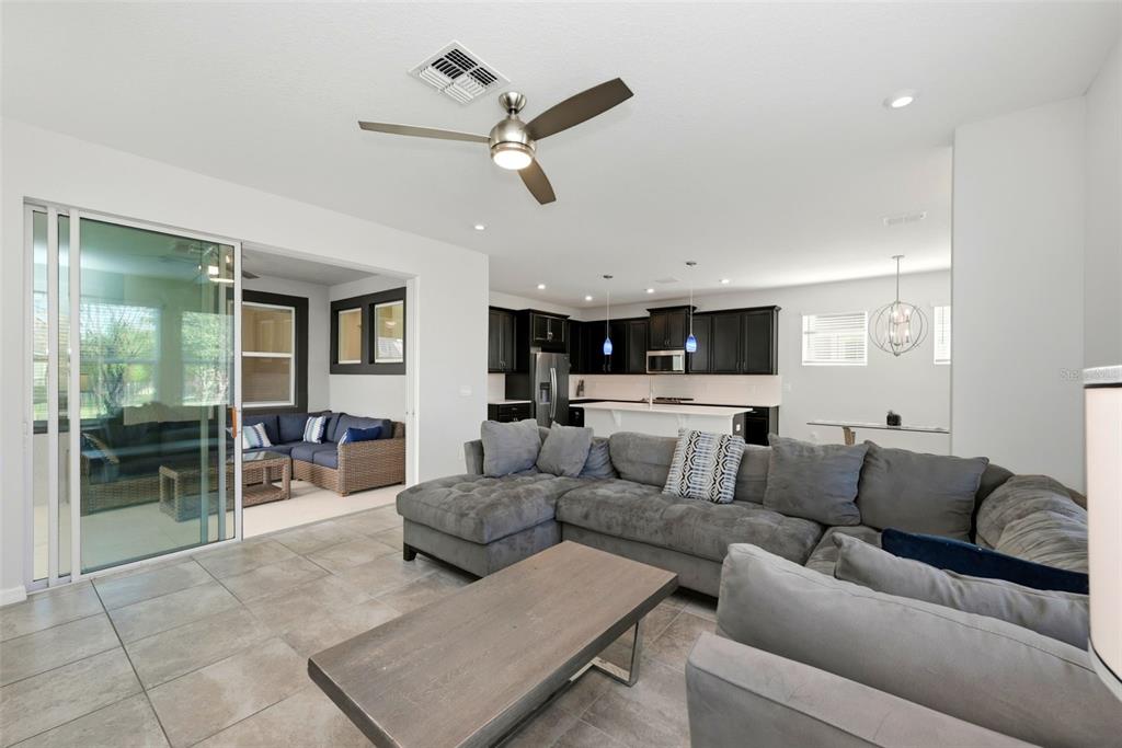16662 Wingspread Loop Winter Garden, FL 34787 - Photo 11 of 24 a living room with furniture and a large window