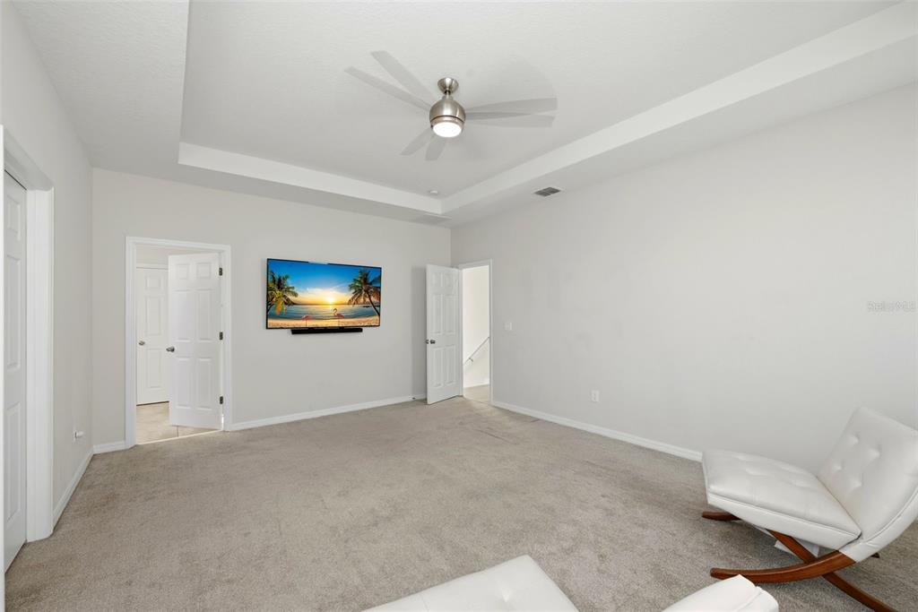16662 Wingspread Loop Winter Garden, FL 34787 - Photo 14 of 24 a view of a livingroom with a ceiling fan and couch
