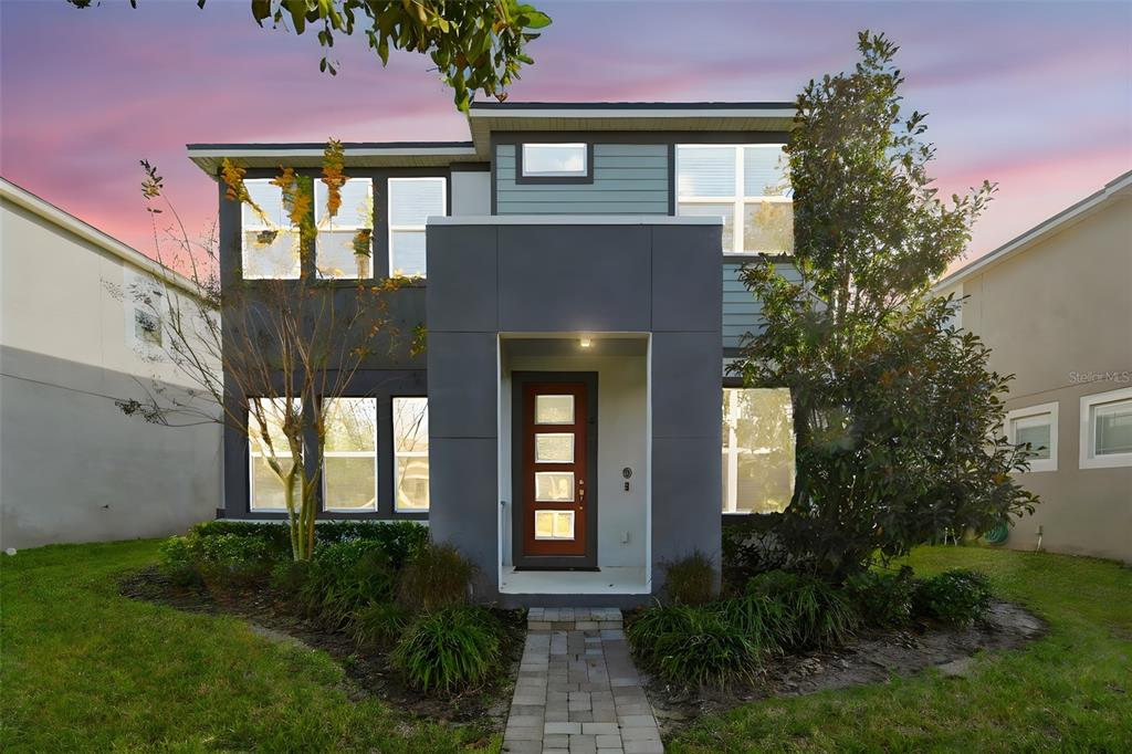 16662 Wingspread Loop Winter Garden, FL 34787 - Photo 2 of 24 a front view of a house with garden