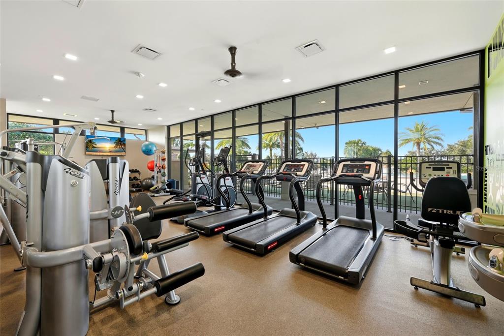 16662 Wingspread Loop Winter Garden, FL 34787 - Photo 23 of 24 a view of a room with gym equipment
