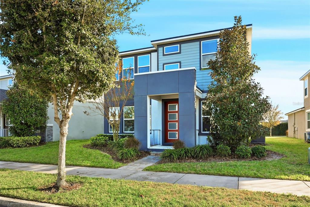 16662 Wingspread Loop Winter Garden, FL 34787 - Photo 3 of 24 a front view of a house with garden
