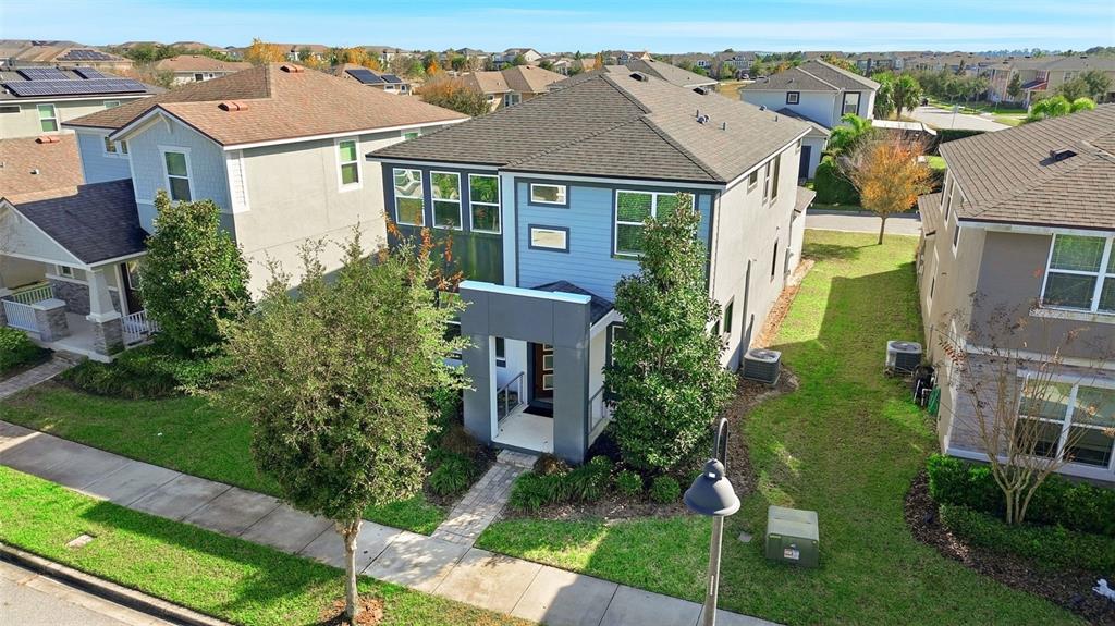 16662 Wingspread Loop Winter Garden, FL 34787 - Photo 4 of 24 an aerial view of a brick house next to a yard