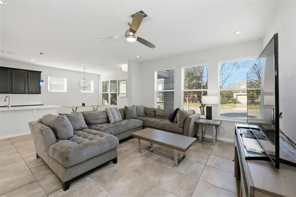 a living room with furniture and a large window