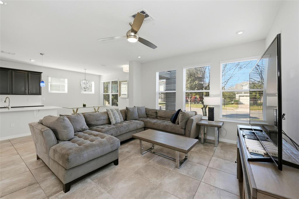 16662 Wingspread Loop Winter Garden, FL 34787 - Photo 10 of 24 a living room with furniture and a large window