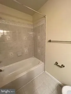 a bathroom with a shower and a toilet