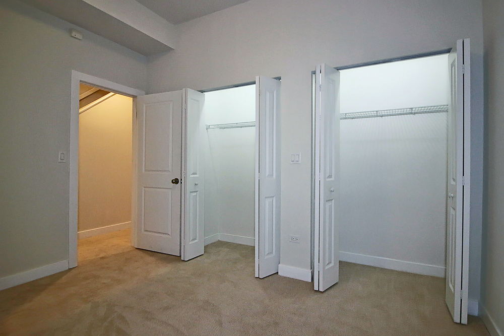 1956 West Ohio Street, Unit 1W Chicago, IL 60622 - Photo 12 of 14 a view of an empty room with a closet