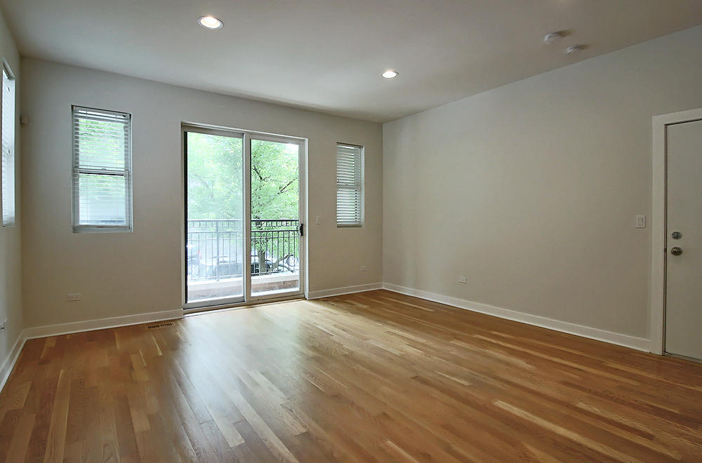 1956 West Ohio Street, Unit 1W Chicago, IL 60622 - Photo 4 of 14 a view of an empty room with wooden floor and a window
