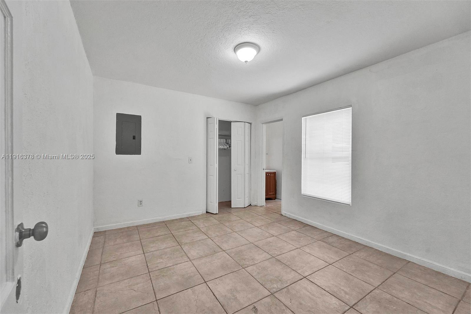 2811 Southwest 3rd Street Miami, FL 33135 - Photo 13 of 40 a view of an empty room and window