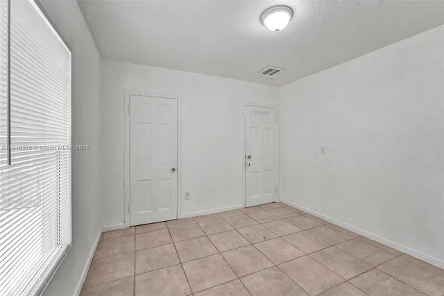 a view of an empty room and window