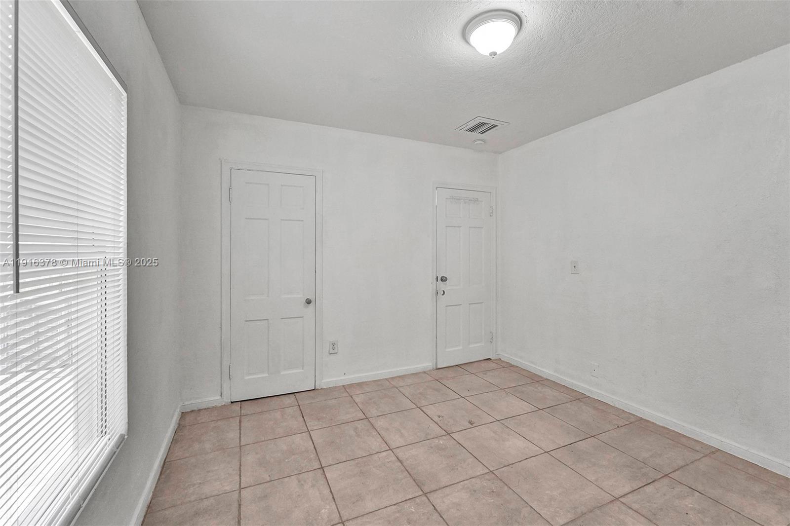 2811 Southwest 3rd Street Miami, FL 33135 - Photo 14 of 40 a view of an empty room and window