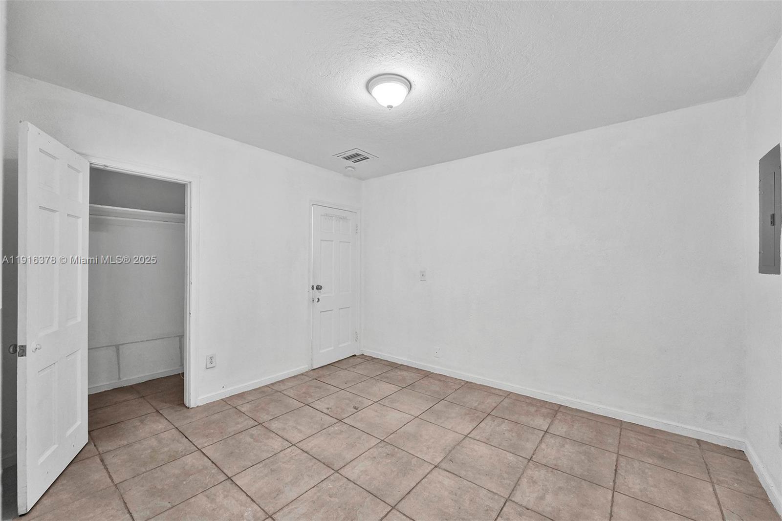 2811 Southwest 3rd Street Miami, FL 33135 - Photo 15 of 40 a view of a room with white walls