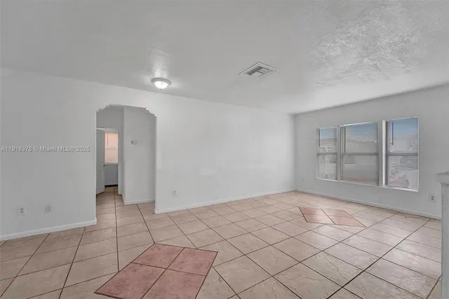 a view of an empty room and window