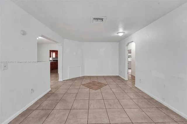 a view of an empty room and window